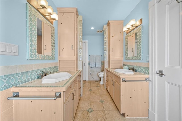 75 Point Allerton Ave, Hull, MA 02045 - bathroom with tile patterned floors, two vanities, toilet, tasteful backsplash, and recessed lighting