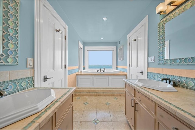 75 Point Allerton Ave, Hull, MA 02045 - full bath featuring tile patterned flooring, a garden tub, vanity, recessed lighting, and backsplash