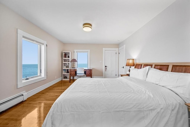 75 Point Allerton Ave, Hull, MA 02045 - bedroom with a baseboard radiator, wood finished floors, and baseboards