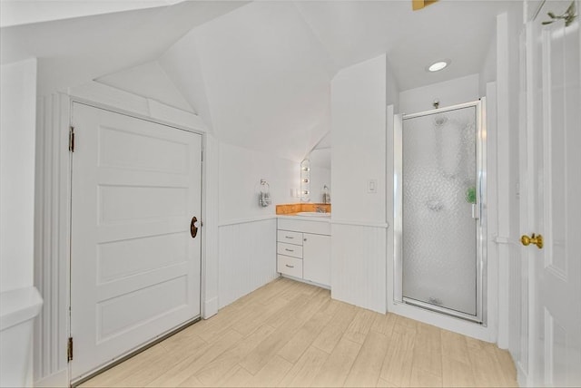 75 Point Allerton Ave, Hull, MA 02045 - full bath featuring a stall shower, vaulted ceiling, vanity, wood finished floors, and a wainscoted wall