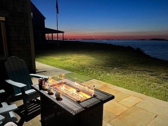 75 Point Allerton Ave, Hull, MA 02045 - view of green lawn with an outdoor fire pit, a water view, and a patio
