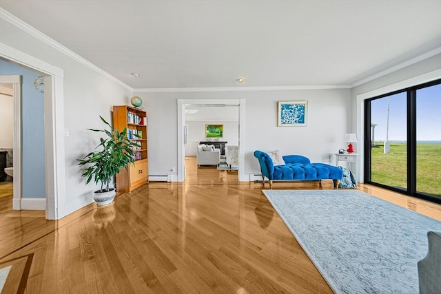 75 Point Allerton Ave, Hull, MA 02045 - living area featuring baseboards, plenty of natural light, wood finished floors, crown molding, and a baseboard radiator