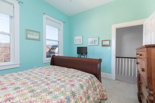 bedroom featuring carpet flooring and baseboards