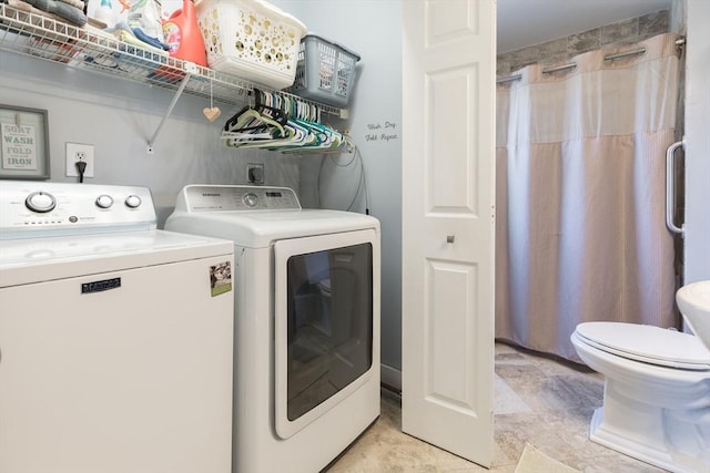 laundry area featuring laundry area and washer and clothes dryer