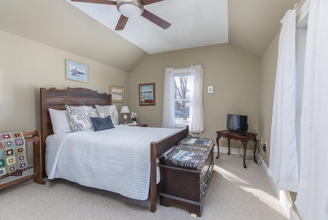 carpeted bedroom with baseboards, a ceiling fan, and vaulted ceiling