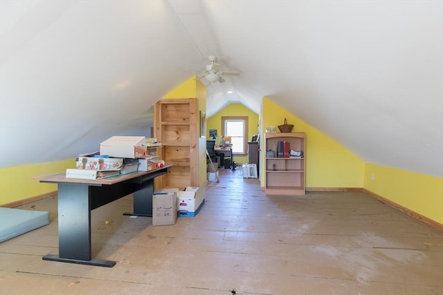 additional living space with baseboards, wood-type flooring, ceiling fan, and vaulted ceiling