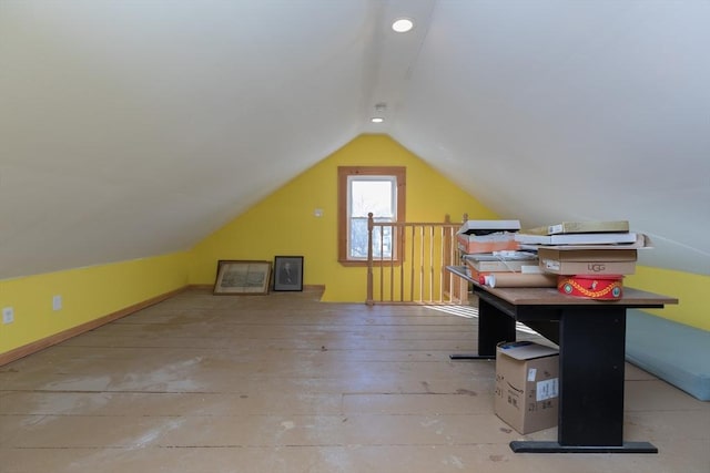 bonus room featuring vaulted ceiling and hardwood / wood-style flooring