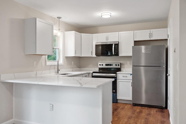 2 Howe Ter Unit 11, Boston, MA 02125 - kitchen with appliances with stainless steel finishes, a sink, a peninsula, light stone countertops, and hanging light fixtures