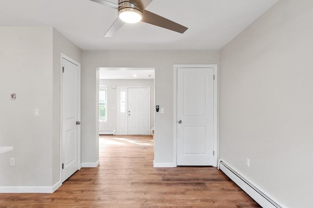 2 Howe Ter Unit 11, Boston, MA 02125 - spare room with ceiling fan, baseboard heating, light wood-style flooring, and baseboards