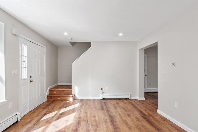 2 Howe Ter Unit 11, Boston, MA 02125 - foyer featuring baseboard heating, wood finished floors, and recessed lighting