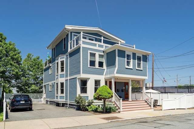 42 Sylvia Rd Unit 42, Medford, MA 02155 - view of front of home featuring driveway, fence, and covered porch