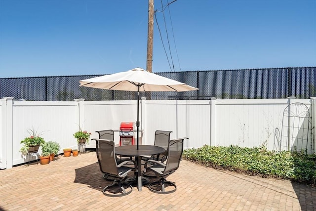 42 Sylvia Rd Unit 42, Medford, MA 02155 - view of patio featuring a fenced backyard and outdoor dining area