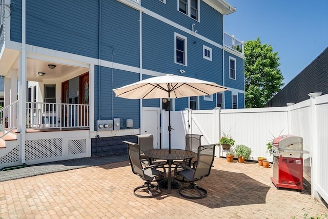 42 Sylvia Rd Unit 42, Medford, MA 02155 - view of patio / terrace with a fenced backyard, outdoor dining area, and a gate