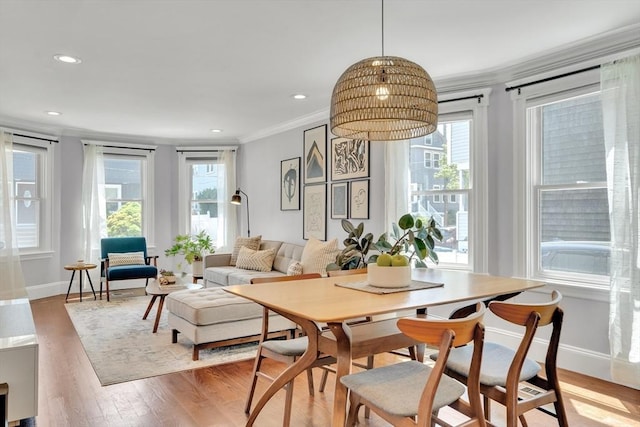 42 Sylvia Rd Unit 42, Medford, MA 02155 - dining area featuring ornamental molding, healthy amount of natural light, light wood-style flooring, baseboards, and recessed lighting