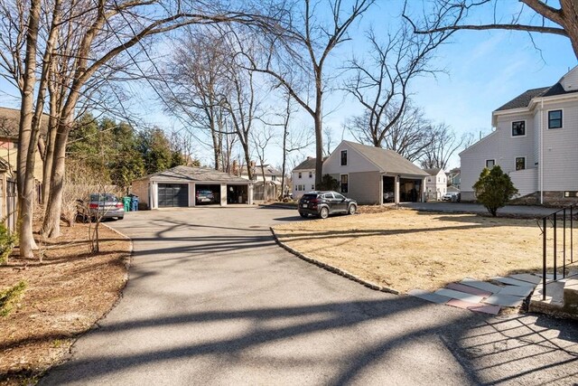 46 Central Ave, Newton, MA 02460 - exterior space featuring a residential view, an outbuilding, and a garage