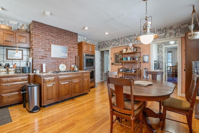 46 Central Ave, Newton, MA 02460 - dining space featuring wallpapered walls and light wood-style flooring