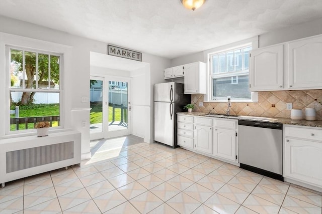 28 Saltonstall Rd, North Andover, MA 01845 - kitchen featuring stainless steel appliances, radiator, a sink, and plenty of natural light