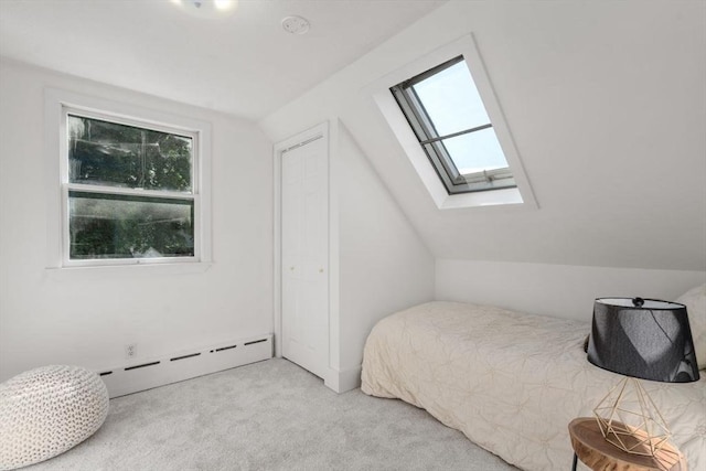 28 Saltonstall Rd, North Andover, MA 01845 - carpeted bedroom featuring a skylight, a baseboard radiator, and vaulted ceiling