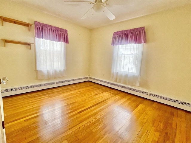 unfurnished room featuring ceiling fan and hardwood / wood-style floors