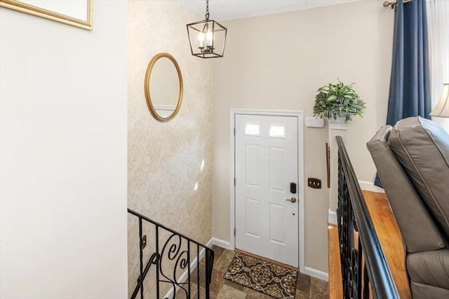 foyer featuring baseboards