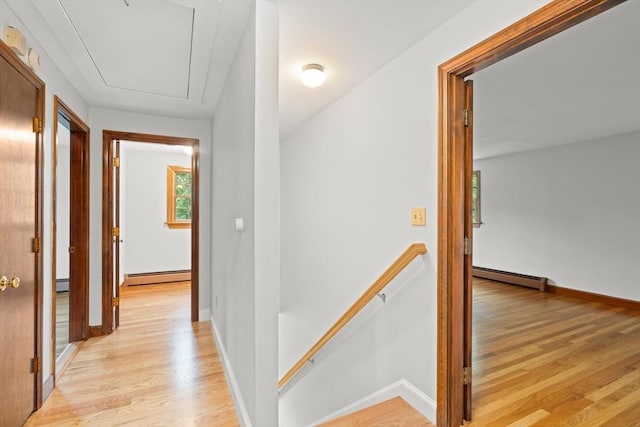 27 Albion Ln, West Newbury, MA 01985 - corridor with an upstairs landing, baseboard heating, and light wood finished floors