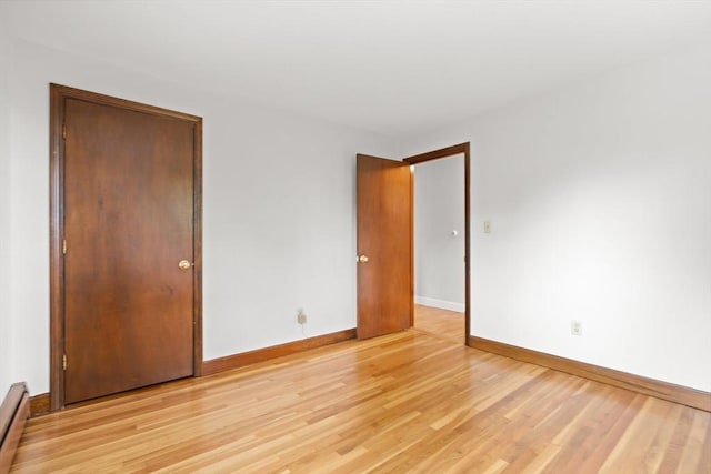 27 Albion Ln, West Newbury, MA 01985 - spare room featuring light wood-style floors and baseboard heating