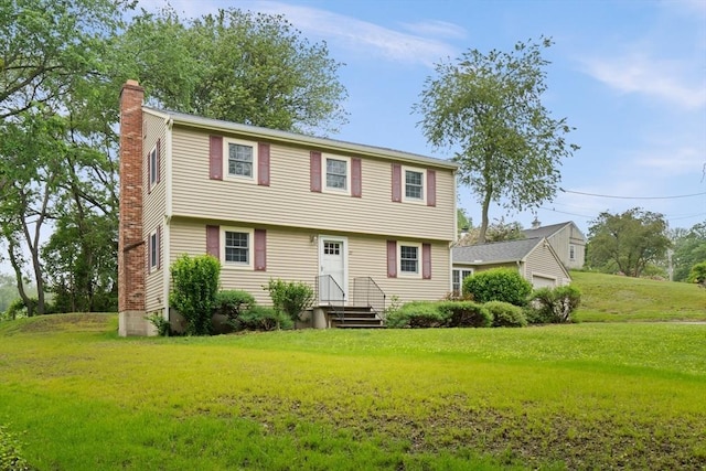 27 Albion Ln, West Newbury, MA 01985 - colonial home with a chimney, a front yard, entry steps, and a detached garage