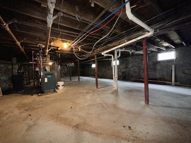 32 Ames St, Worcester, MA 01604 - basement featuring water heater and a heating unit