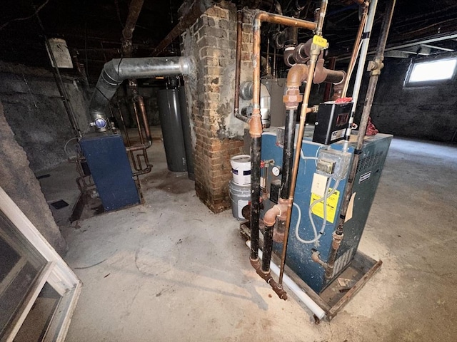 32 Ames St, Worcester, MA 01604 - utility room with water heater and a heating unit