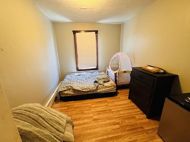 32 Ames St, Worcester, MA 01604 - bedroom featuring light wood finished floors and a textured ceiling