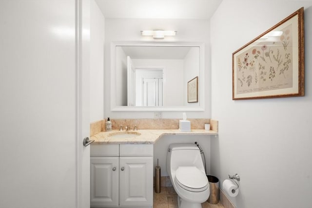 bathroom featuring toilet and vanity