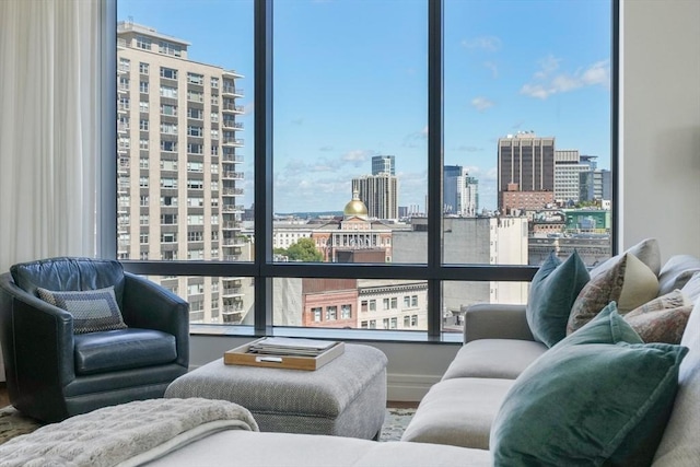 living room with a city view and plenty of natural light