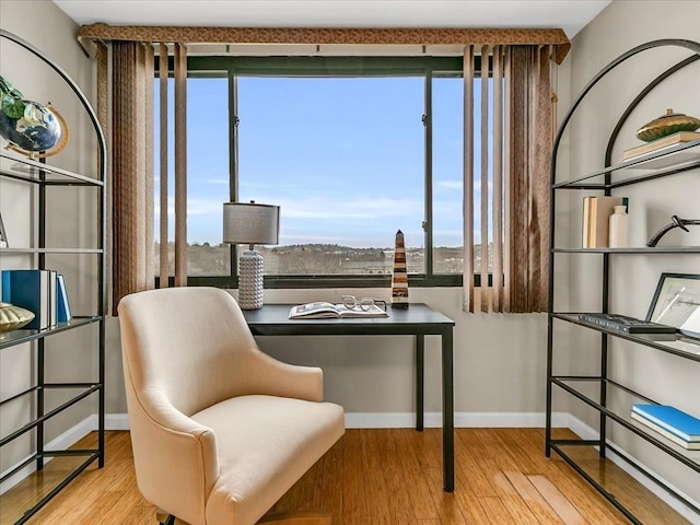 sitting room featuring wood finished floors and baseboards