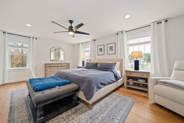 bedroom featuring light wood-style floors, a ceiling fan, and recessed lighting