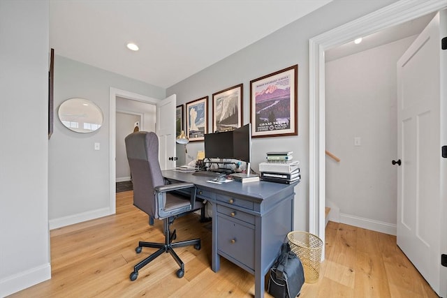 office featuring light wood-style floors, baseboards, and recessed lighting