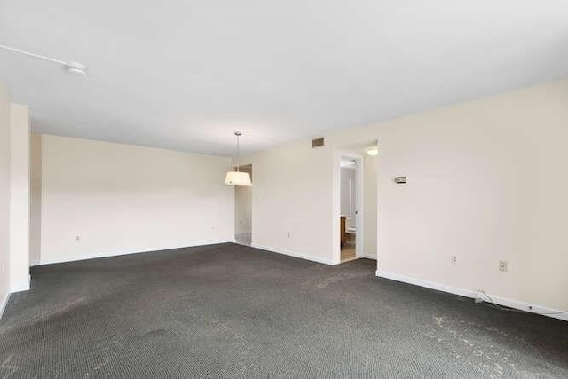 196 Locust Unit 2-508, Lynn, MA 01904 - unfurnished room with dark carpet and baseboards