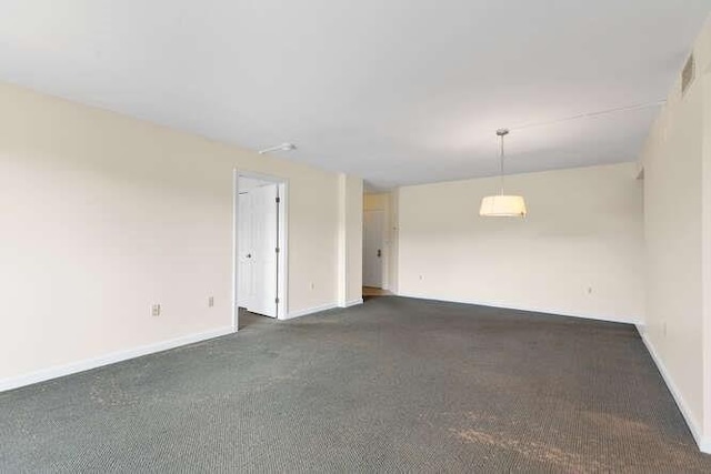 196 Locust Unit 2-508, Lynn, MA 01904 - spare room featuring dark colored carpet and baseboards