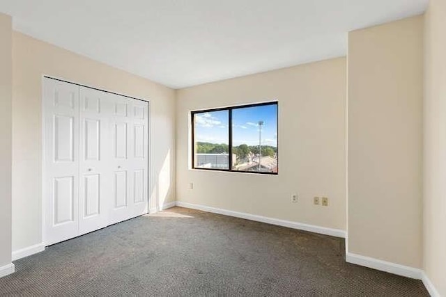 196 Locust Unit 2-508, Lynn, MA 01904 - unfurnished bedroom featuring carpet flooring and a closet