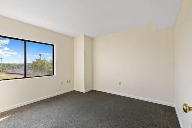 196 Locust Unit 2-508, Lynn, MA 01904 - empty room with dark colored carpet and baseboards