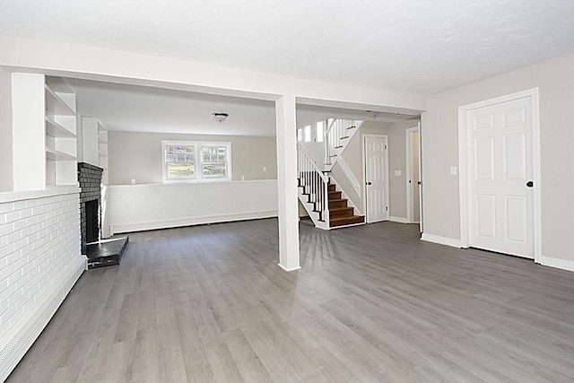 unfurnished living room with hardwood / wood-style floors