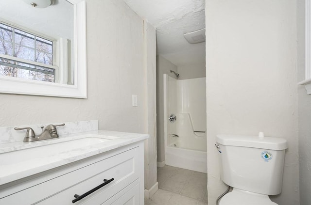 full bathroom with tile patterned floors, vanity, shower / bathtub combination, and toilet