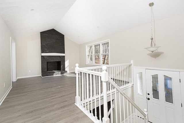 interior space with hardwood / wood-style floors and lofted ceiling