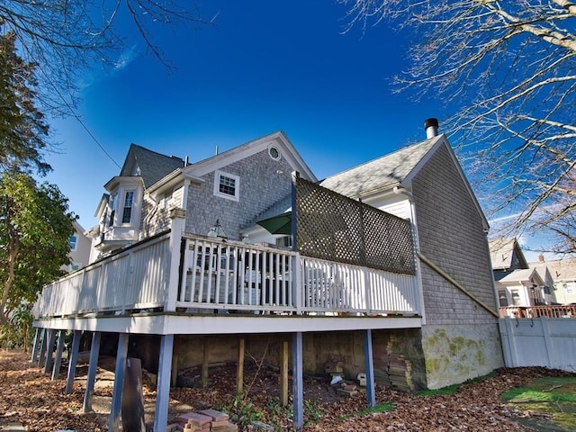 back of property with a wooden deck