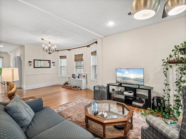 living room featuring a notable chandelier and hardwood / wood-style floors