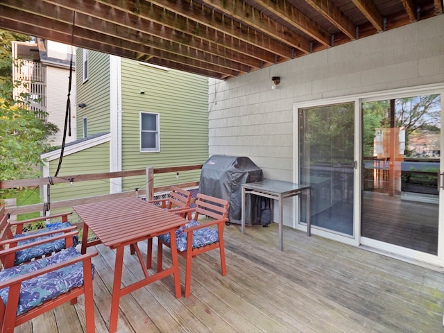 wooden deck featuring grilling area