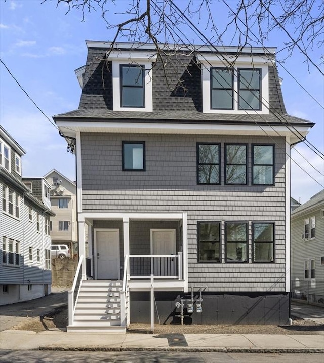 37-39 Governor Winthrop Rd, Somerville, MA 02145 - victorian home with a shingled roof and covered porch