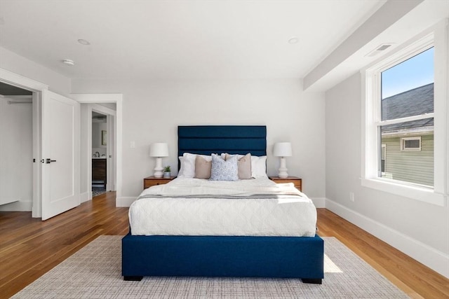 37-39 Governor Winthrop Rd, Somerville, MA 02145 - bedroom featuring baseboards and wood finished floors