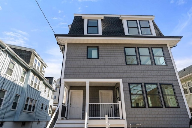37-39 Governor Winthrop Rd, Somerville, MA 02145 - victorian home featuring roof with shingles, covered porch, and mansard roof