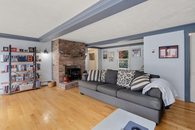 living room featuring a baseboard heating unit and wood finished floors
