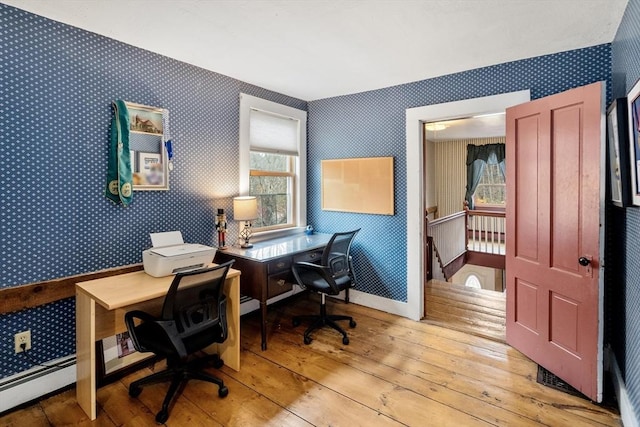 office space featuring light wood-style floors, wallpapered walls, and a wealth of natural light